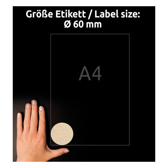 Størrelsessammenligning med hånd, Artikkel: L7106-25, ett ark naturbrune etiketter, Format: ⌀ 60 mm, Farge: naturbrun?